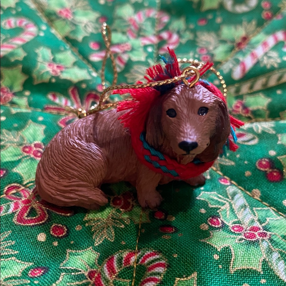 A Little Dachshund Ornament. She’s a Red-Brown Dog with a Red & Green Scarf. EC